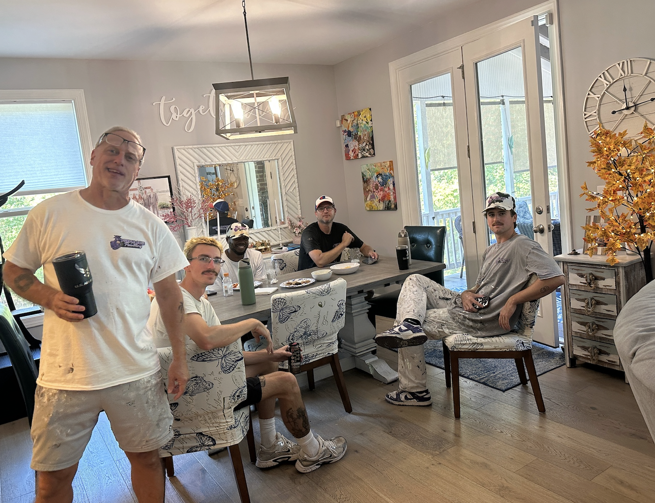 the purple cow team sitting at a table