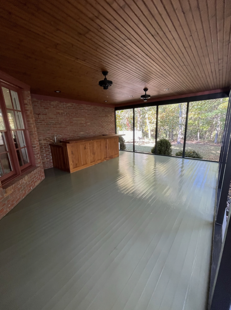 a covered patio with a fresh coat of paint